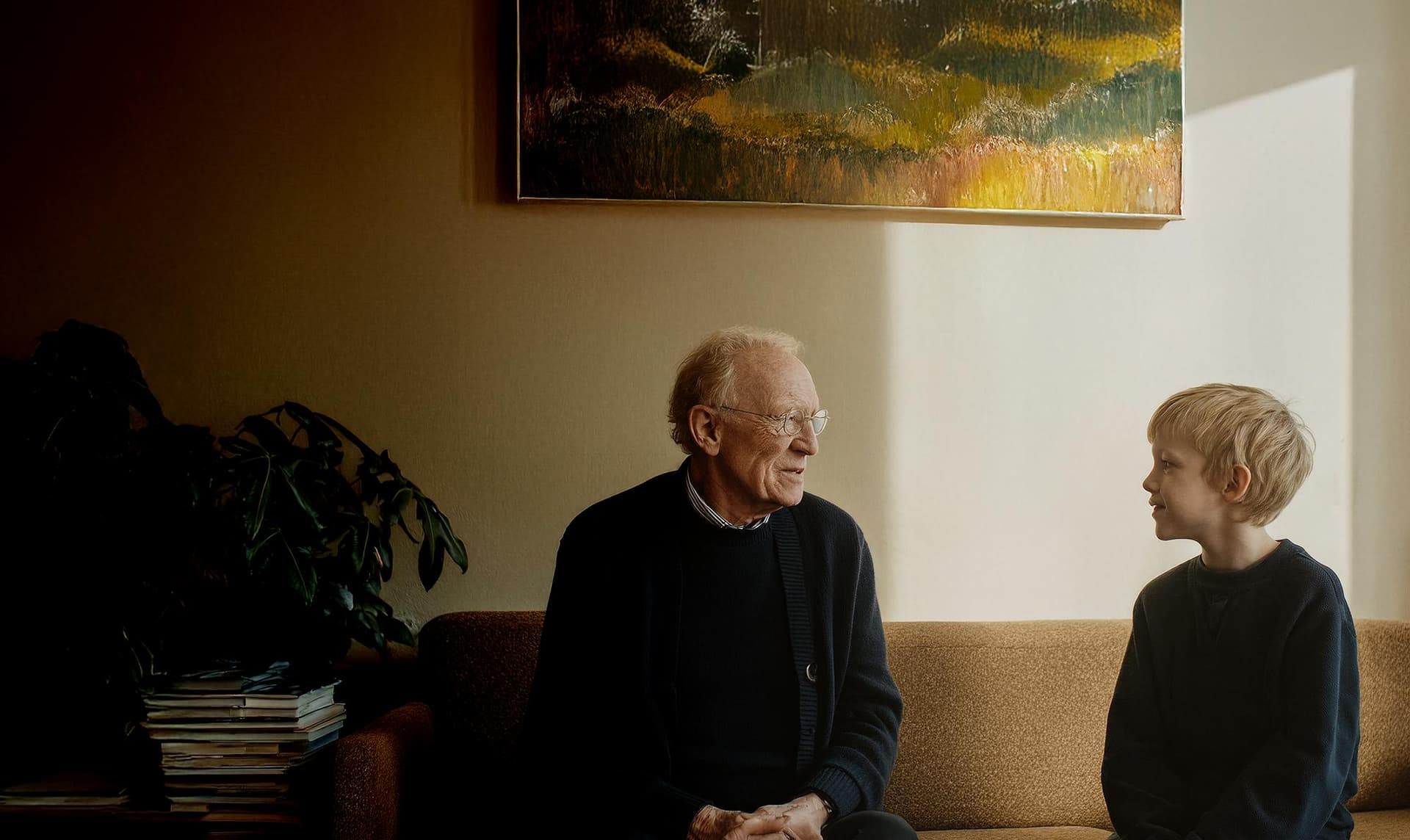 Grandpa looking into the direction of a blond child